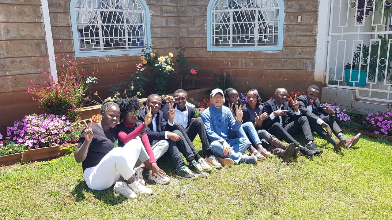 Students relaxing on the college lawn