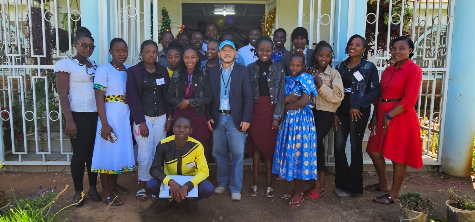Students and staff outside the college entrance